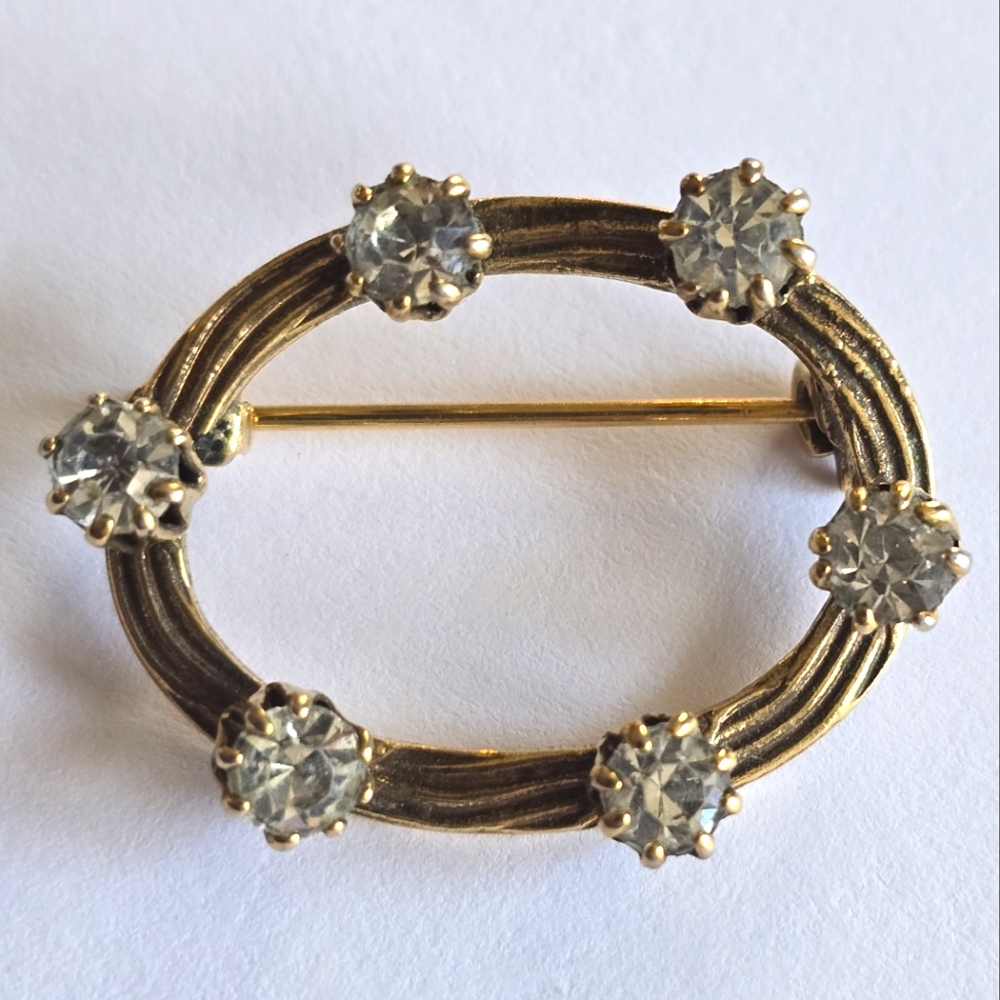 Vintage brooch open oval dark gold tone clear rhinestones